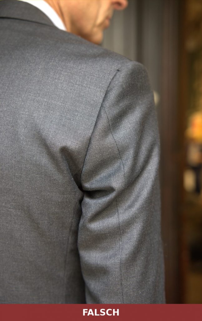 Wrong: puckering at the sleeve head under the arm